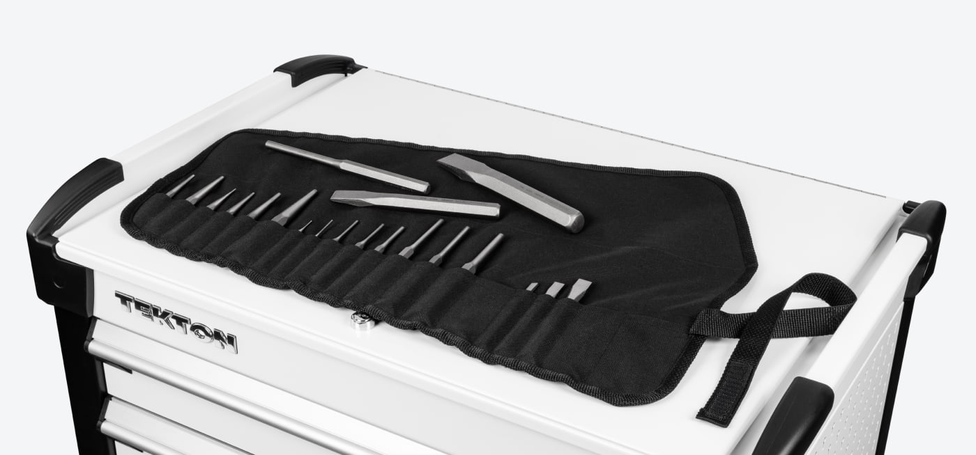 TEKTON Pouch with 20-piece punch and chisel set unrolled on top of a TEKTON Tool Cart
